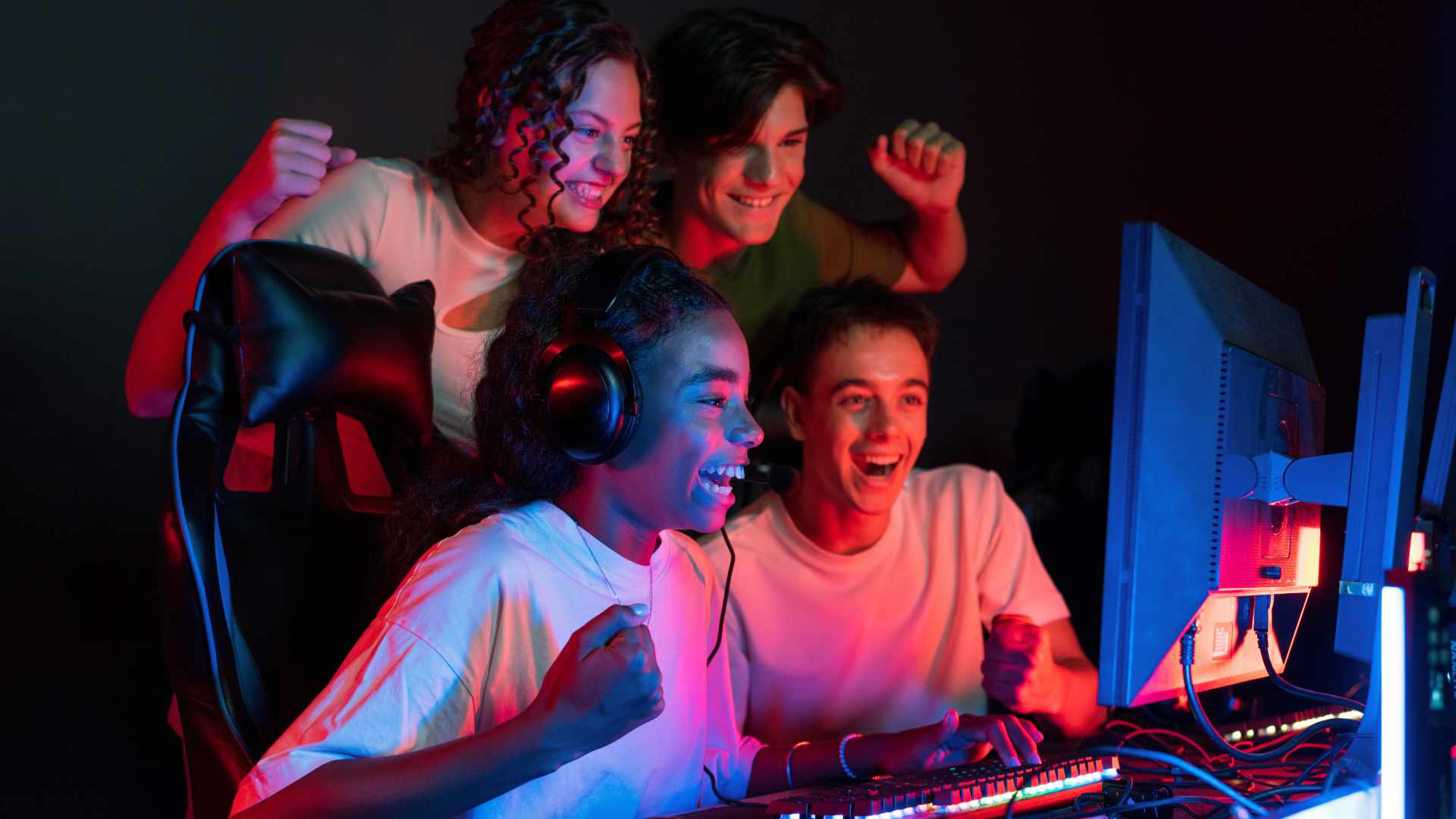 Teens playing in video game club
